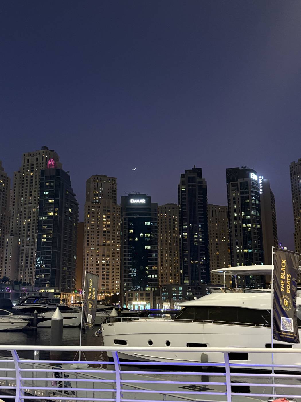 Yachts docked in Dubai Marina at dusk