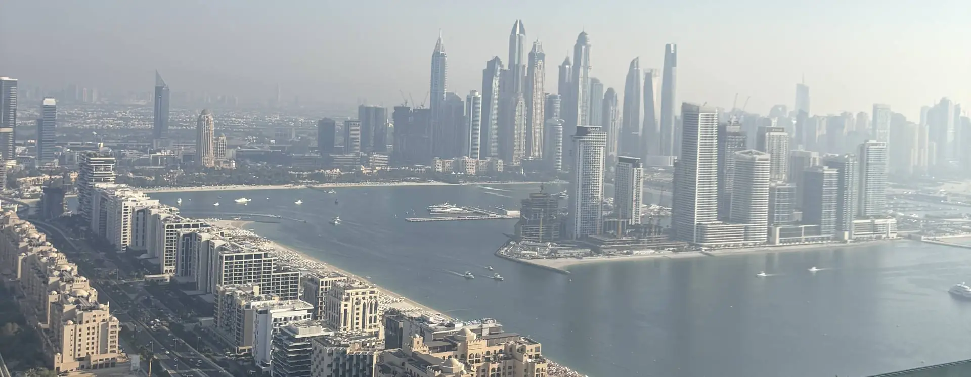 Aerial view of the Dubai Marina skyline with towers along the waterfront